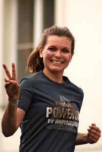 woman running wearing gray shirt